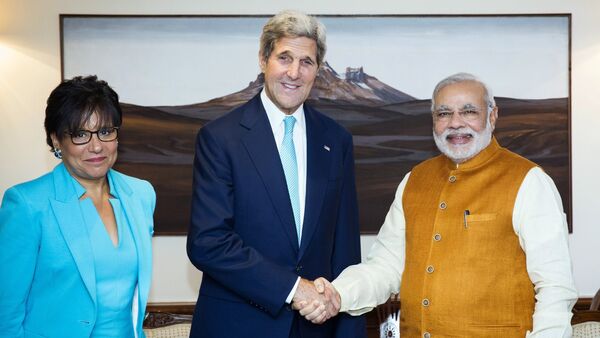 U.S. Secretary of State John Kerry shakes hands with Indian Prime Minister Narendra Modi and U.S. Secretary of Commerce Penny Pritzker stand by their sides at Modi's residence in New Delhi, India, Friday, Aug. 1, 2014 - Sputnik International