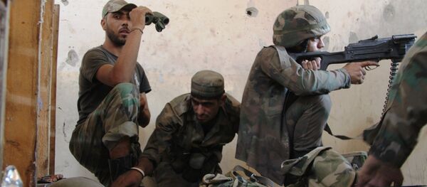 Syrian Army soldier mans his position during the storming of the air force academy in southern Aleppo - Sputnik International