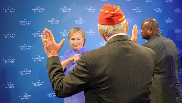 Democratic presidential nominee Hillary Clinton winks at the National Commander of the American Legion Dale Barnett after she addressed the National Convention in Cincinnati, Ohio, U.S., August 31, 2016 - Sputnik International