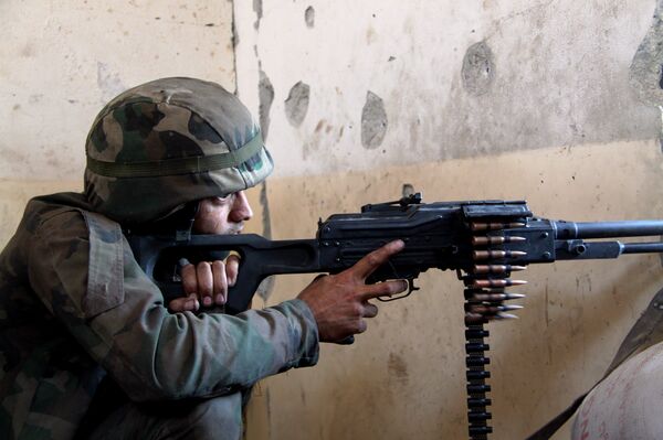 A Syrian army fighter in position during the assault of the BBC school in the southern part of the Syrian city of Aleppo A Syrian army fighter in position during the assault of the BBC school in the southern part of the Syrian city of Aleppo - Sputnik International