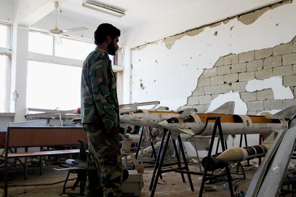 Syrian army fighter in position during the assault of the BBC school in the southern part of the Syrian city of Aleppo Syrian army fighter in position during the assault of the BBC school in the southern part of the Syrian city of Aleppo - Sputnik International