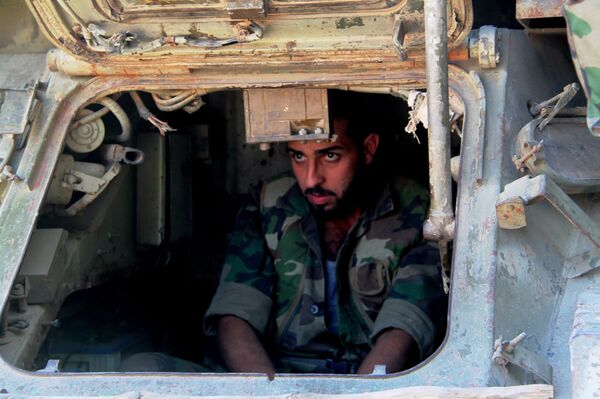 Syrian army fighter in position during the assault of the BBC school in the southern part of the Syrian city of Aleppo Syrian army fighter in position during the assault of the BBC school in the southern part of the Syrian city of Aleppo - Sputnik International