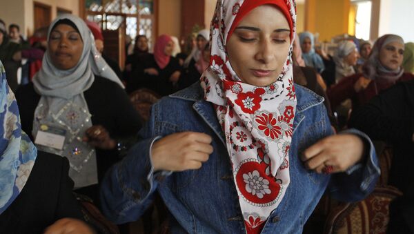 Palestinian health workers practice a breathing yoga exercise at a workshop designed to teach relaxation techniques in Gaza City, Monday, March 9, 2009. - Sputnik International