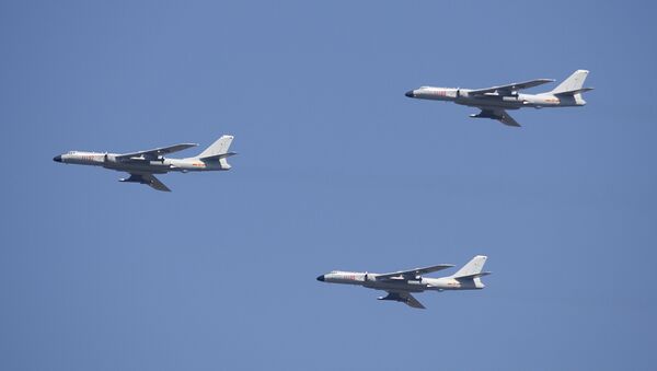 H-6K cruise missile carriers fly in formation during a parade - Sputnik International