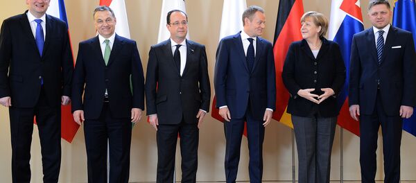 French President Francois Hollande, Polish Prime Minister Donald Tusk, German Chancellor Angela Merkel and Slovak Prime Minister Robert Fico pose for a picture prior a meeting with Visegrad Group (Poland, the Czech Republic, Hungary and Slovakia) on March 6, 2013 in Warsaw. - Sputnik International