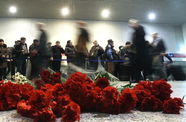 Flowers in the Domodedovo arrival lounge to commemorate the victims of the act of terrorism on January 24. (File) Flowers in the Domodedovo arrival lounge to commemorate the victims of the act of terrorism on January 24. (File) - Sputnik International
