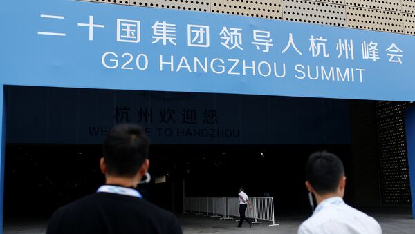 Security personnel patrol in front of the entrance of a conference centre, where the G20 summit is held, in Hangzhou, Zhejiang Province, China - Sputnik International