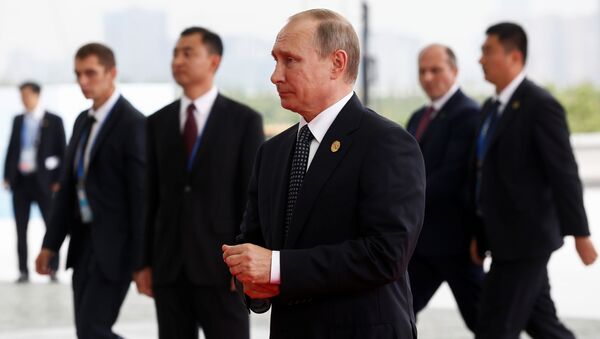 Russian President Vladimir Putin (C) arrives to attend the G20 Summit in Hangzhou, Zhejiang province, China, September 4, 2016. - Sputnik International