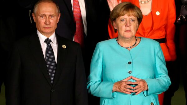 Russian President Vladimir Putin and German Chancellor Angela Merkel attend the G20 Summit in Hangzhou, Zhejiang province, China - Sputnik International