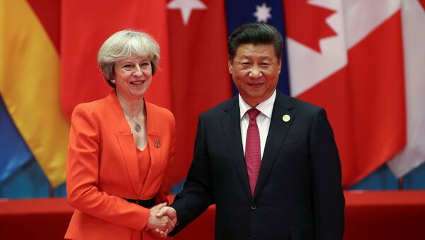 Chinese President Xi Jinping (R) shakes hands with Britain's Prime Minister Theresa May during the G20 Summit in Hangzhou, Zhejiang province, China September 4, 2016. - Sputnik International