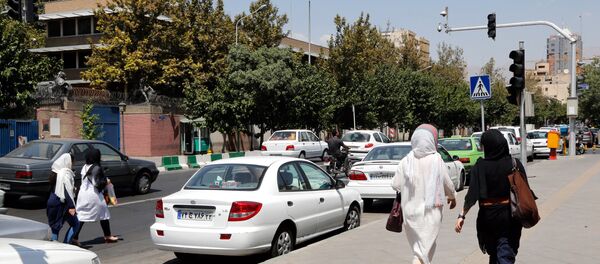 Iranians walk past the closed British embassy in the capital Tehran, on August 21, 2015 - Sputnik International