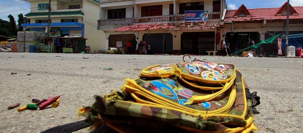 A school bag lies on a street next to the site of a bomb attack at Tak Bai district in the troubled southern province of Narathiwat, Thailand, September 6, 2016 - Sputnik International