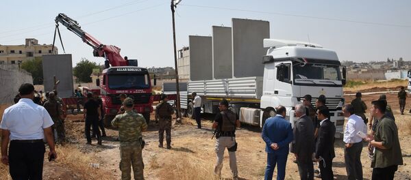 Civil and military authorities inspect the construction of a border wall between Turkey and Syria near the Mursitpinar border gate in Suruc, bordering with the northern Syrian town of Kobani, in southeastern Sanliurfa province, Turkey, August 29, 2016 Civil and military authorities inspect the construction of a border wall between Turkey and Syria near the Mursitpinar border gate in Suruc, bordering with the northern Syrian town of Kobani, in southeastern Sanliurfa province, Turkey, August 29, 2016 - Sputnik International