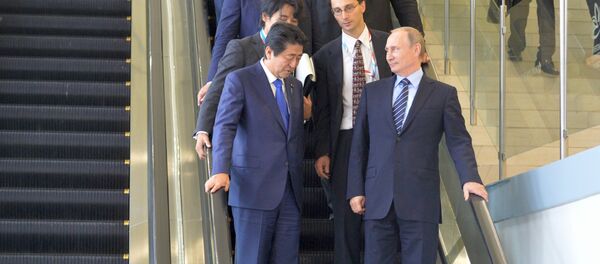 From right in the foreground: Russian President Vladimir Putin and Japanese Prime Minister Shinzo Abe meet at the Eastern Economic Forum on Russky Island. file photo From right in the foreground: Russian President Vladimir Putin and Japanese Prime Minister Shinzo Abe meet at the Eastern Economic Forum on Russky Island. file photo - Sputnik International