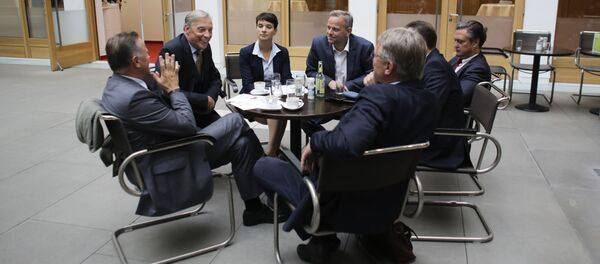 AfD (Alternative for Germany) party chairwoman, Frauke Petry, center, talks with party members prior to a news conference in Berlin, Monday, Sept. 5, 2016 - Sputnik International