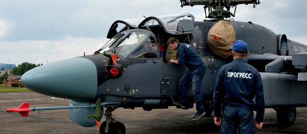 Mechanics work on a Ka-52K Katran helicopter at the Progress aviation plant in the Primorsky Territory Mechanics work on a Ka-52K Katran helicopter at the Progress aviation plant in the Primorsky Territory - Sputnik International