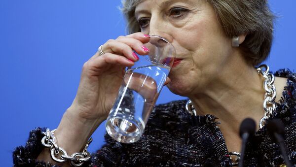 British Prime Minister Theresa May drinks while addressing reporters after the closing of G20 Summit in Hangzhou, Zhejiang Province, China, September 5, 2016. - Sputnik International