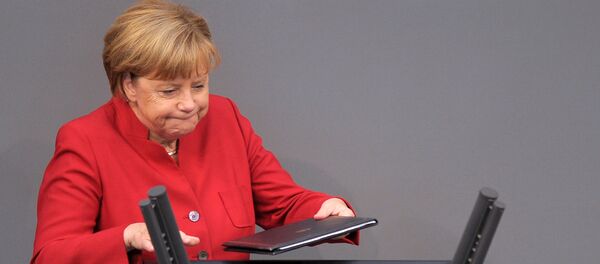 German Chancellor Angela Merkel walks to the desk during a meeting at the lower house of parliament Bundestag on 2017 budget in Berlin, Germany, September 7, 2016 German Chancellor Angela Merkel walks to the desk during a meeting at the lower house of parliament Bundestag on 2017 budget in Berlin, Germany, September 7, 2016 - Sputnik International