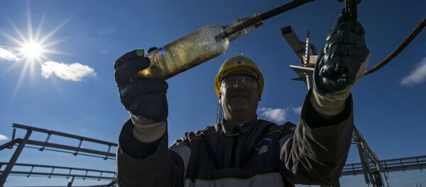 Oil and gas production operator of the RN-Purneftegaz Company, a subsidiary of the Rosneft Oil Company, prepared to take a sample of liquid from a well at Russia's Yamal-Nenets Autonomous District. file photo Oil and gas production operator of the RN-Purneftegaz Company, a subsidiary of the Rosneft Oil Company, prepared to take a sample of liquid from a well at Russia's Yamal-Nenets Autonomous District. file photo - Sputnik International