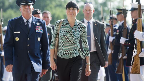 Norway's Defense Minister Ine Marie Eriksen Søreide walks past an honor guard as he arrives to attend a meeting of defense ministers of the Global Coalition to Counter ISIL at Joint Base Andrews in Maryland, July 20, 2016 - Sputnik International