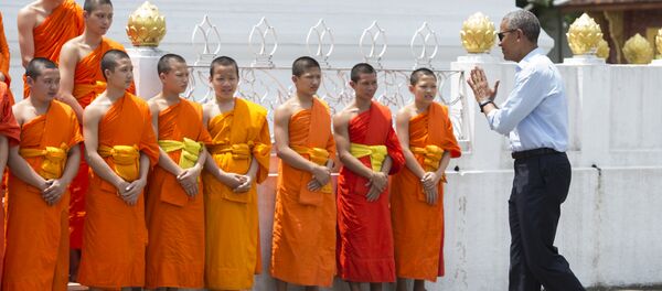US President Barack Obama greets monks as he tours the Wat Xieng Thong Buddhist Temple in Luang Prabang on September 7, 2016 - Sputnik International