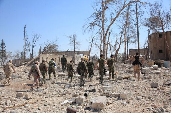 Forces loyal to Syria's President Bashar al-Assad walk at a military complex, after they recaptured areas in southwestern Aleppo that rebels had seized last month, Syria, in this handout picture provided by SANA on September 5, 2016. - Sputnik International