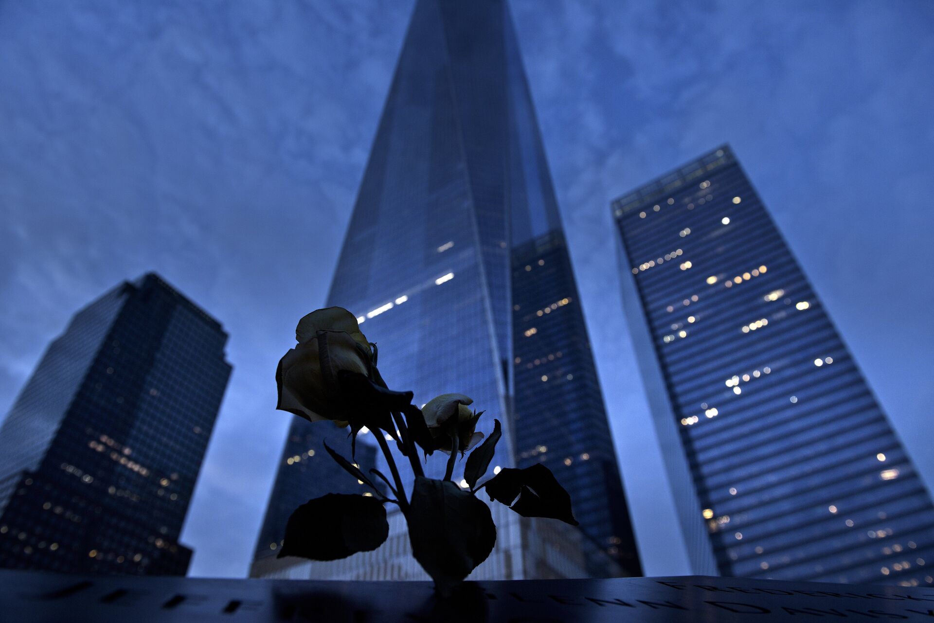 A view of One World Trade Center from the North Pool, which marks the former site of the North Tower of the World Trade Center, at Ground Zero the night before the 15th anniversary of the September 11, 2001 terrorist attacks in the United States in New York - Sputnik International, 1920, 13.10.2021