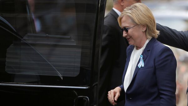 U.S. Democratic presidential candidate Hillary Clinton climbs into her van outside her daughter Chelsea's home in New York, New York, United States September 11, 2016, after Clinton left ceremonies commemorating the 15th anniversary of the September 11 attacks feeling overheated. - Sputnik International