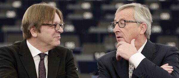 EU Commission chief Jean-Claude Juncker (R) speaks with Alliance of liberals and Democrats for Europe (ALDE) group leader and Belgian member of the European Parliament Guy Verhofstadt prior to a debate on the outgoing Italian Presidency of the Council of the European Union, at the European Parliament on January 13, 2015 in Strasbourg, eastern France. EU Commission chief Jean-Claude Juncker (R) speaks with Alliance of liberals and Democrats for Europe (ALDE) group leader and Belgian member of the European Parliament Guy Verhofstadt prior to a debate on the outgoing Italian Presidency of the Council of the European Union, at the European Parliament on January 13, 2015 in Strasbourg, eastern France. - Sputnik International
