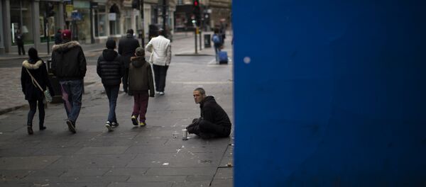 In this Sunday, July 3, 2016 photo, people walk by a beggar at a street in downtown Glasgow, Scotland - Sputnik International