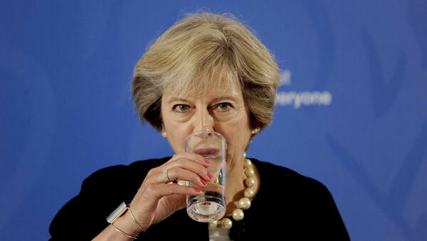 Prime Minister Theresa May takes a drink as she delivers a speech at the British Academy in London, where she said that a new wave of grammar schools will end selection by house price and give every child the chance to go to a good school, in Britain September 9, 2016 - Sputnik International