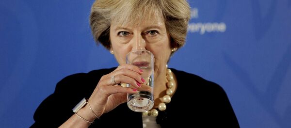 Prime Minister Theresa May takes a drink as she delivers a speech at the British Academy in London, where she said that a new wave of grammar schools will end selection by house price and give every child the chance to go to a good school, in Britain September 9, 2016 Prime Minister Theresa May takes a drink as she delivers a speech at the British Academy in London, where she said that a new wave of grammar schools will end selection by house price and give every child the chance to go to a good school, in Britain September 9, 2016 - Sputnik International