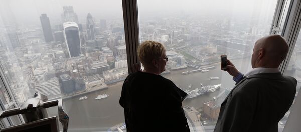 A man takes a picture of London's skyline from the viewing platform of a skyscraper in central London, Thursday, April 3, 2014 A man takes a picture of London's skyline from the viewing platform of a skyscraper in central London, Thursday, April 3, 2014 - Sputnik International