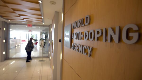 A woman walks into the head office of the World Anti-Doping Agency (WADA) in Montreal, Quebec, Canada November 9, 2015 - Sputnik International