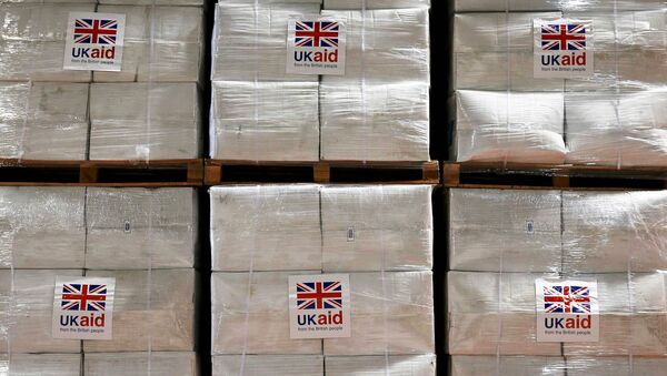 Boxes containing kitchen sets are stored at a UK Aid Disaster Response Centre where humanitarian supplies are being collected to be airlifted to Iraq at Cotswold Airport near the village of Kemble, Gloucestershire, southern England on August 14, 2014. - Sputnik International