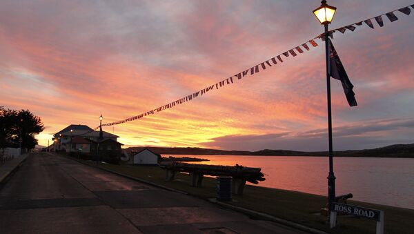 The sun is seen at dusk in Stanley, Falklands Islands, June 13, 2012 - Sputnik International