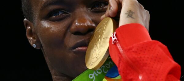 Gold medallist Nicola Adams (GBR) of Britain poses with her medal. Gold medallist Nicola Adams (GBR) of Britain poses with her medal. - Sputnik International