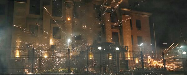 Fireworks launched by protesters, explode near the Russian embassy. Fireworks launched by protesters, explode near the Russian embassy. - Sputnik International