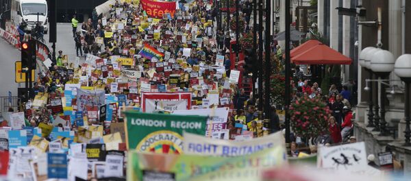 Demonstrators take part in a march calling for the British parliament to welcome refugees in the UK in central London Demonstrators take part in a march calling for the British parliament to welcome refugees in the UK in central London - Sputnik International