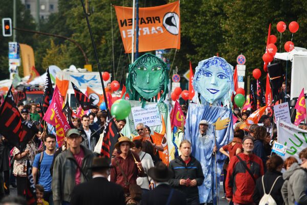 Rights activists take part in a march to protest against the Transatlantic Trade and Investment Partnership (TTIP) and Comprehensive Economic and Trade Agreement (CETA) in Berlin, Germany Rights activists take part in a march to protest against the Transatlantic Trade and Investment Partnership (TTIP) and Comprehensive Economic and Trade Agreement (CETA) in Berlin, Germany - Sputnik International