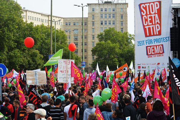 Rights activists take part in a march to protest against the Transatlantic Trade and Investment Partnership (TTIP) and Comprehensive Economic and Trade Agreement (CETA) in Berlin, Germany Rights activists take part in a march to protest against the Transatlantic Trade and Investment Partnership (TTIP) and Comprehensive Economic and Trade Agreement (CETA) in Berlin, Germany - Sputnik International