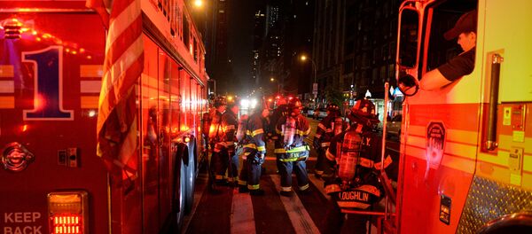 New York City firefighters stand near the site of an explosion in the Chelsea neighborhood of Manhattan, New York New York City firefighters stand near the site of an explosion in the Chelsea neighborhood of Manhattan, New York - Sputnik International