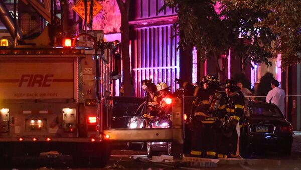 New York City firefighters stand near the site of an explosion in the Chelsea neighborhood of Manhattan, New York September 17, 2016. - Sputnik International