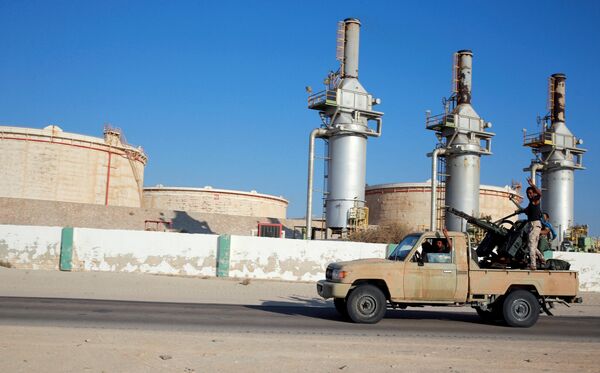 Libyan forces loyal to eastern commander Khalifa Haftar ride a pickup truck at the Zueitina oil terminal in Zueitina, west of Benghazi, Libya. file photo Libyan forces loyal to eastern commander Khalifa Haftar ride a pickup truck at the Zueitina oil terminal in Zueitina, west of Benghazi, Libya. file photo - Sputnik International