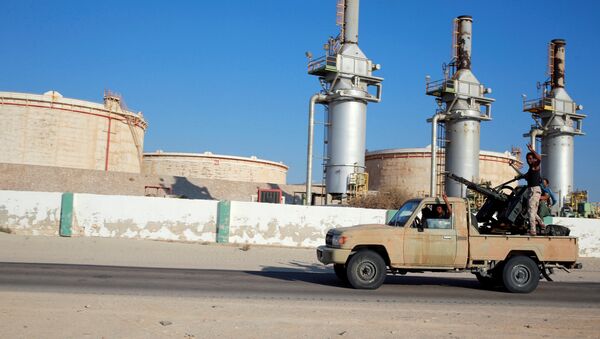 Libyan forces loyal to eastern commander Khalifa Haftar ride a pickup truck at the Zueitina oil terminal in Zueitina, west of Benghazi, Libya - Sputnik International