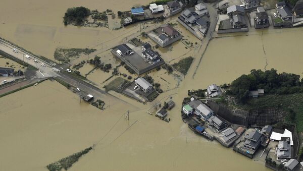 An aerial view shows flooded area due to heavy rains caused by Typhoon Malakas in Nobeoka, Miyazaki Prefecture, southwestern Japan, in this photo taken by Kyodo September 20, 2016 - Sputnik International