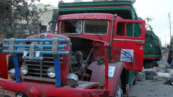 A damaged UNHCR truck after an airstrike on the rebel held Urm al-Kubra town, western Aleppo city, Syria - Sputnik International