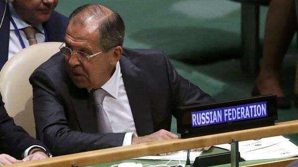 Russian Foreign Minister Sergei Lavrov confers with members of his delegation as U.S. President Barack Obama speaks during the 71st United Nations General Assembly in Manhattan, New York, U.S - Sputnik International