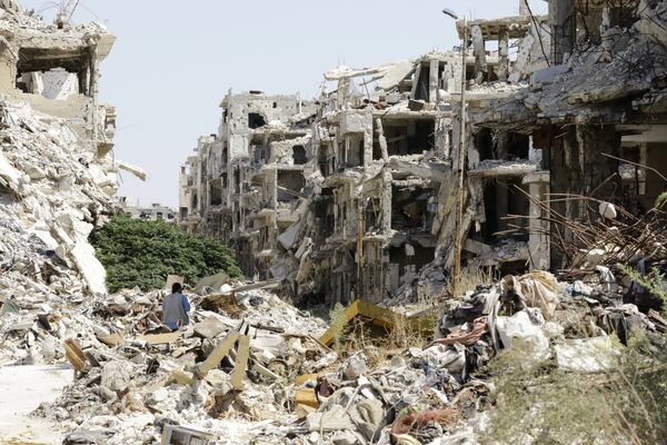 A general view shows destroyed buildings in the government-held Jouret al-Shiah neighbourhood of the central Syrian city of Homs on September 19, 2016 A general view shows destroyed buildings in the government-held Jouret al-Shiah neighbourhood of the central Syrian city of Homs on September 19, 2016 - Sputnik International