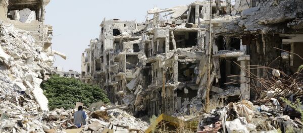 A general view shows destroyed buildings in the government-held Jouret al-Shiah neighbourhood of the central Syrian city of Homs on September 19, 2016 A general view shows destroyed buildings in the government-held Jouret al-Shiah neighbourhood of the central Syrian city of Homs on September 19, 2016 - Sputnik International